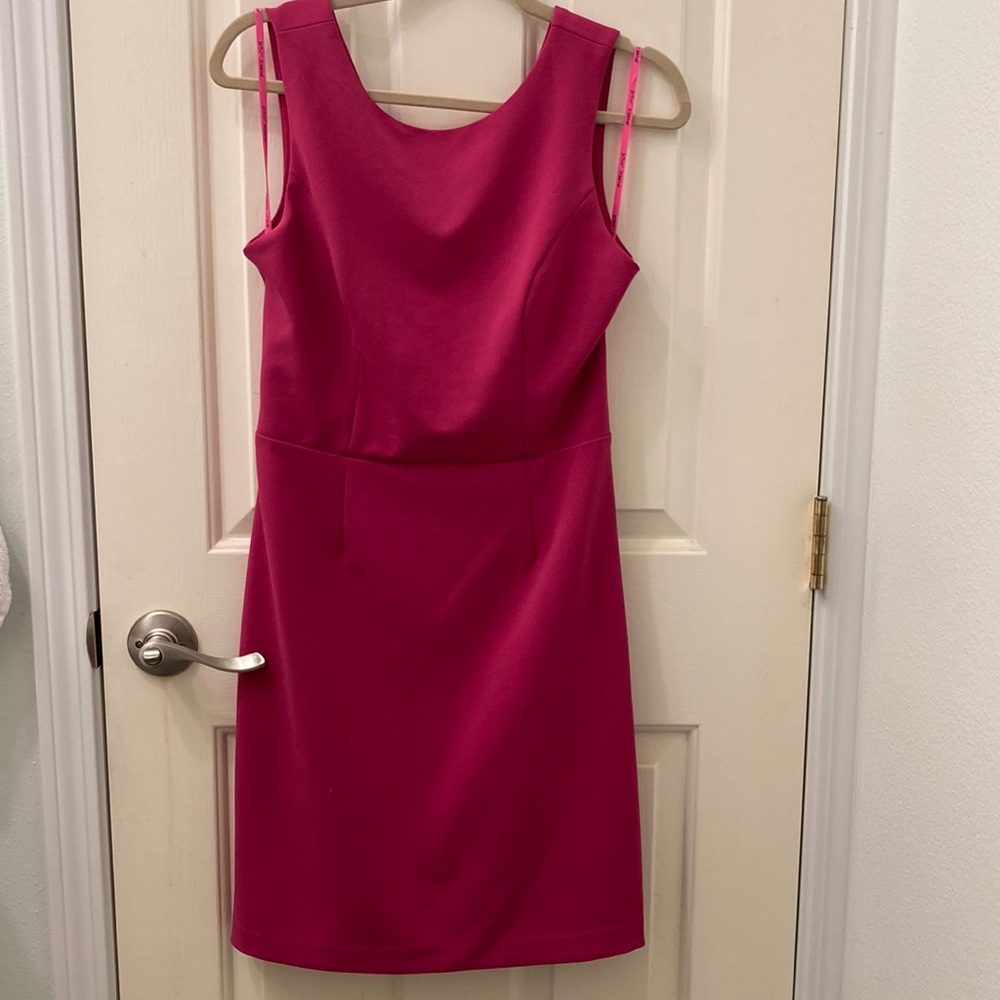 Short pink dress, worn less than 5 times. Has a cut out design on lower back.